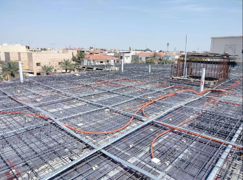 Reinforcement and service conduits prepared on a construction site before the concrete pour